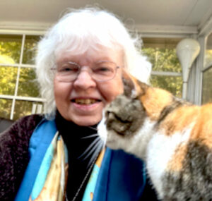 Jill N. Henry, EdD. and her calico cat Kali